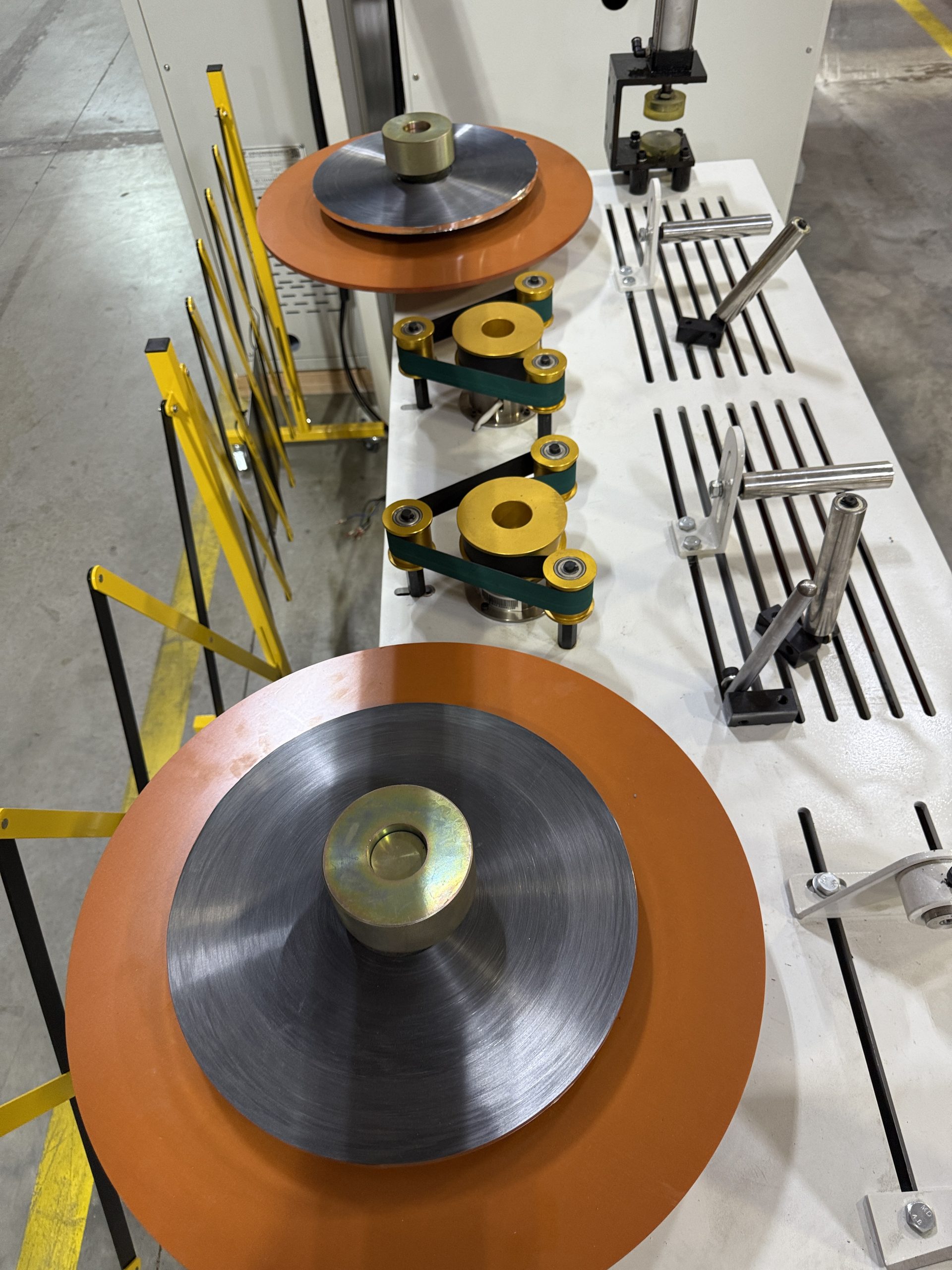Mylar/aluminum shielding tape spools feeding into the cabling line